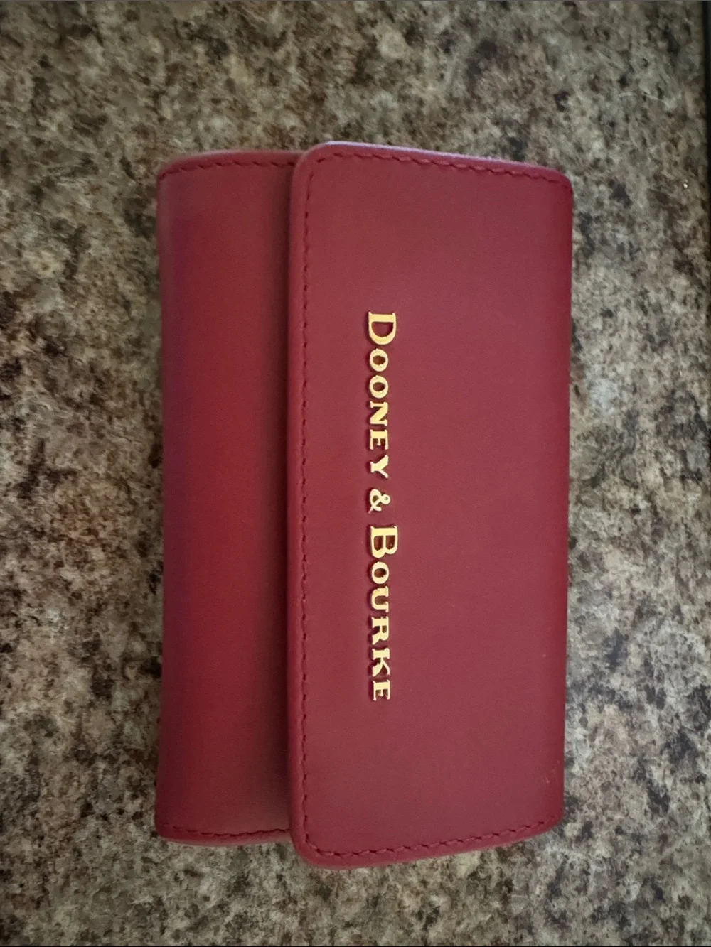 Dooney & Bourke Burgundy Leather wallet with Gold Logo